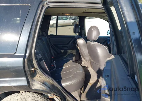 2000 Jeep Grand Cherokee Laredo из США, поврежденный, VIN 1J4GW48S5YC407407